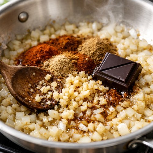 Step 2: Bloom Your Spices and Add the Chocolate